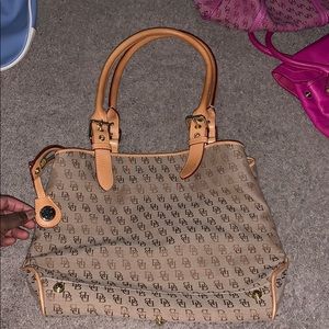 Brown and tan dooney & Burke purse